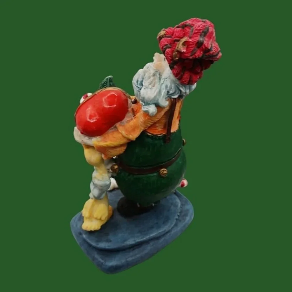 Santa claus figurine with gift and duck